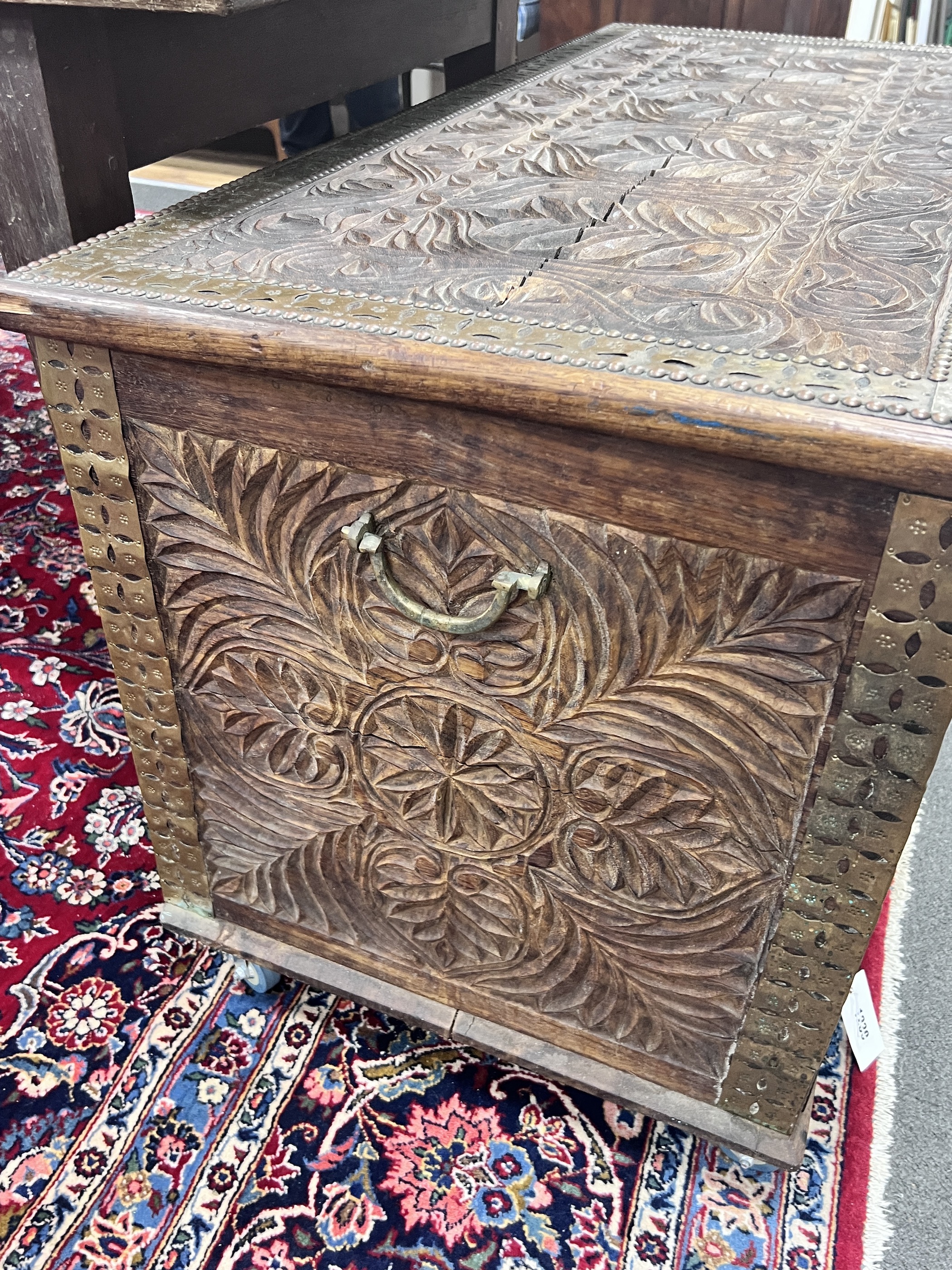 A brass mounted carved hardwood Zanzibar chest, width 110cm, depth 54cm, height 61cm